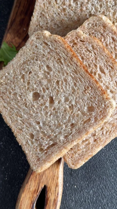 Whole-grain bread fresh baked goods fluffy bread slices tasty snack Stock Footage 335652509