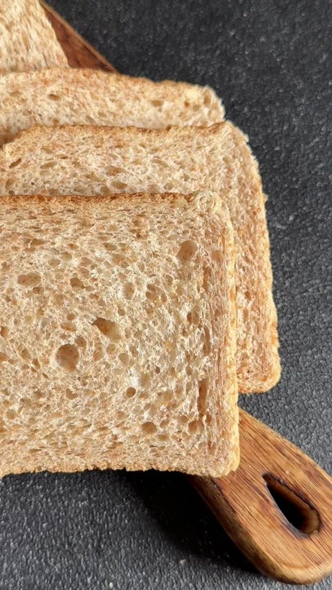 Whole-grain bread fresh baked goods fluffy bread slices tasty snack Stock Footage 335652513