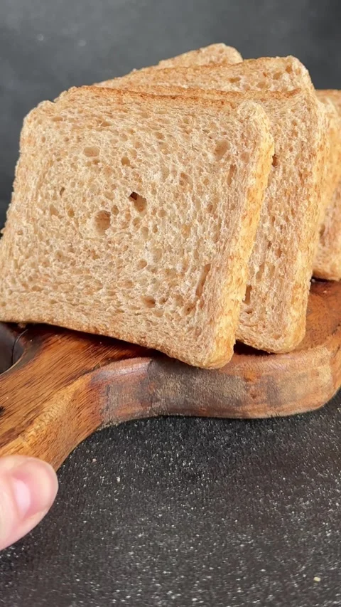 Whole-grain bread fresh baked goods fluffy bread slices tasty snack Stock Footage 335652514