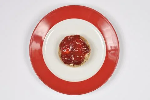 Whole Grain Bread with Jam on a Red Plate Stock Photos