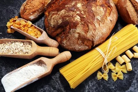 Whole grain products with complex carbohydrates on rustic background Stock Photos