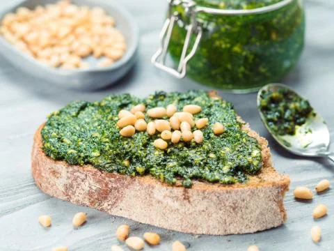 Whole grain rye bread with fresh pesto 스톡 사진