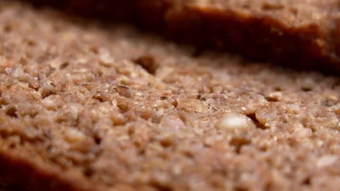 Whole grain rye bread slices. Macro shot. Stock Footage 331343469
