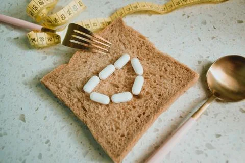 Whole grain slice of bread with D letter as "diet". Stock Photos