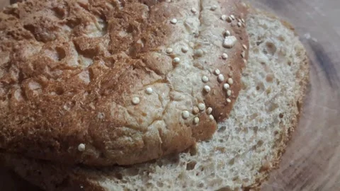 Whole grain sliced bread loaf close up motion video clip animation Stock Footage 339249030
