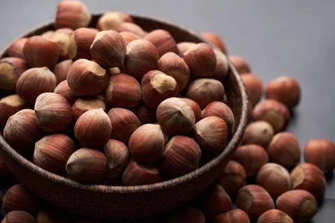 Whole hazelnuts nuts with shell close-up studio shot Stock Photos
