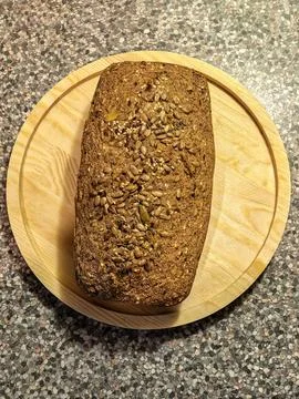 Whole Keto Seed Bread Loaf on Wooden Board Stock Photos