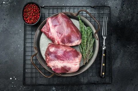 Whole lamb mutton hearts with visible muscle fibers placed on metal plate w.. Stock Photos