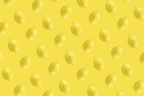 Whole lemon fruit pattern on yellow color background Stock Photos