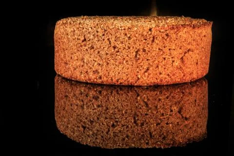 Whole loaf of round rye bread with sesame seeds freshly baked at home Stock Photos