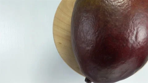 Whole mango fruit on a plate. Stock Footage 143385759