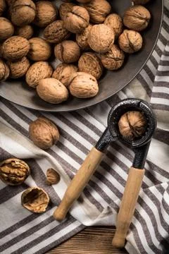 Whole nuts and nutcracker. Stock Photos