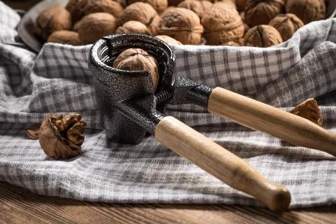 Whole nuts and nutcracker. Stock Photos