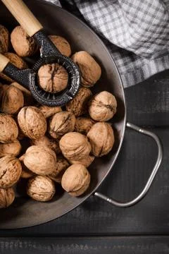 Whole nuts and nutcracker. Stock Photos