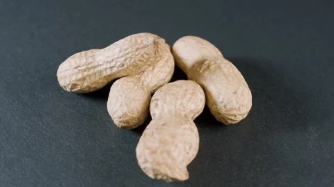 Whole peanot in shell on black background Stock Footage 328651684
