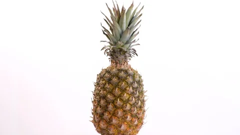 Whole Pineapple Rotates On A White Background Video stock 130144843