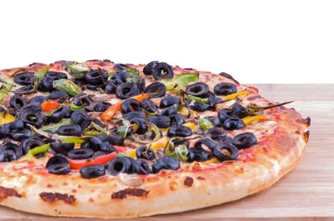 Whole pizza left side view Stock Photos