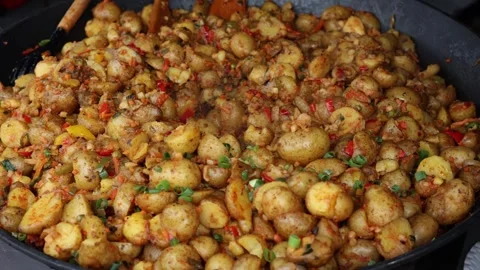 Whole potatoes baked in a pan Stock Footage 287120104