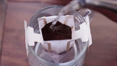 The whole process of brewing drip coffee with hot water Stock Footage 340252308