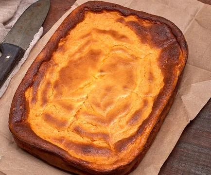 Whole rectangular pie of cottage cheese and pumpkin Stock Photos
