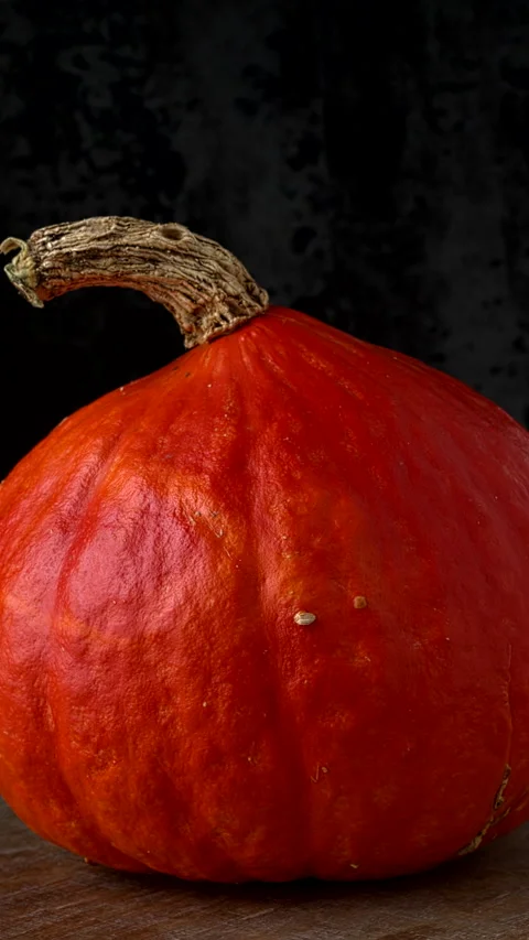 Whole Red Kuri squash. Vertical video. Stock Footage 284313402