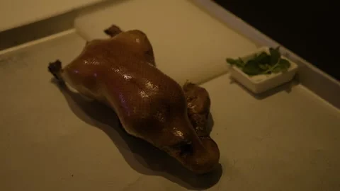 Whole Roasted Bird Ready for Carving in Beijing Restaurant Kitchen Setting Stock Footage 345765060