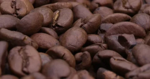 Whole roasted coffee beans close-up. Stock Footage 143566618
