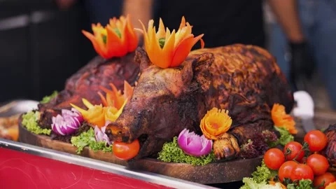 Whole roasted pig served with vegetables. Stock Footage 341471995