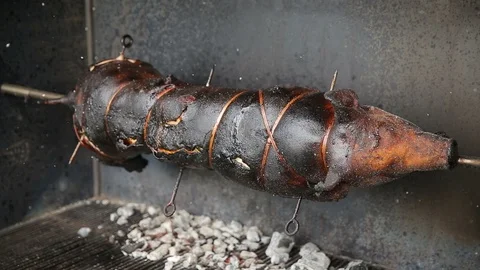 Whole roasted pork cooked with fire and charcoal, roast beef detail, Food street Stock Footage 111662823
