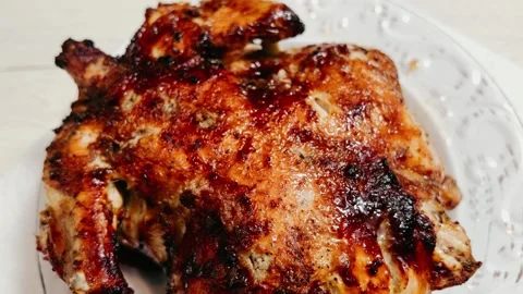 Whole roasted spatchcock chicken with crispy golden brown seasoned skin Stock Footage 346805013
