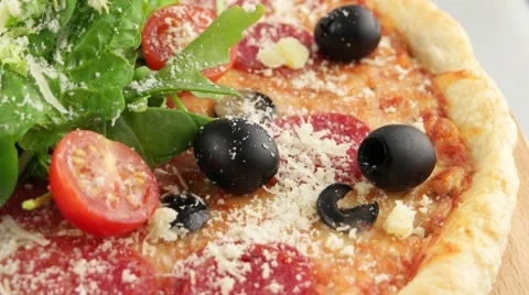Whole salami pizza with cherry tomatoes Stock Footage 57768099