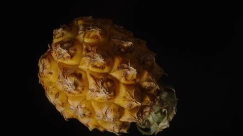 Whole Small Pineapple Rotating and Falling in Slow Motion with Macro Zoom Video stock 310668782