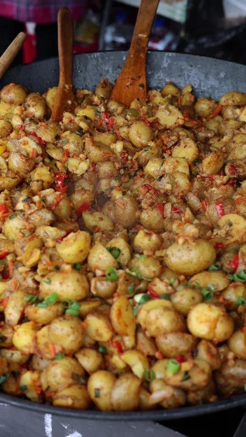 Whole stewed potatoes vertical video Stock Footage 287119741