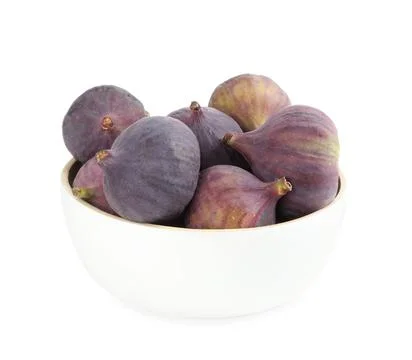 Whole tasty fresh figs in bowl on white background Stock Photos