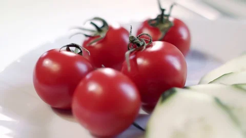 Whole tomatoes and sliced cucumbers Stock Footage 129303247