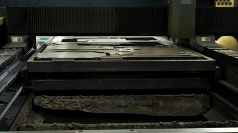  whole unprocessed sheet of metal is driven into the CNC plasma cutter. Stock Footage 246618289