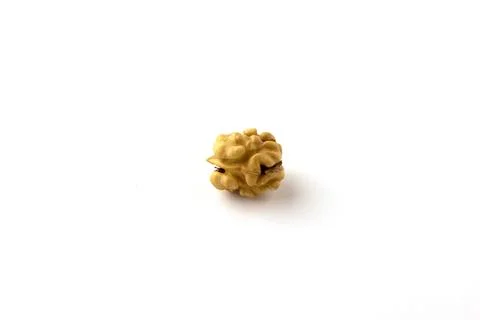 Whole walnut kernel on a white background. Stock Photos