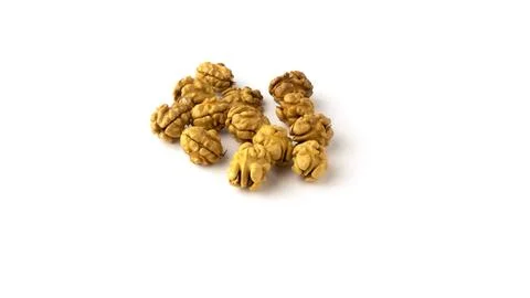 Whole walnut kernels on a white background. Stock Photos