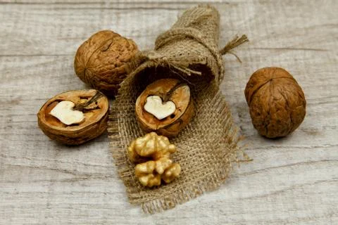 Whole walnuts and kernels on the table 스톡 사진
