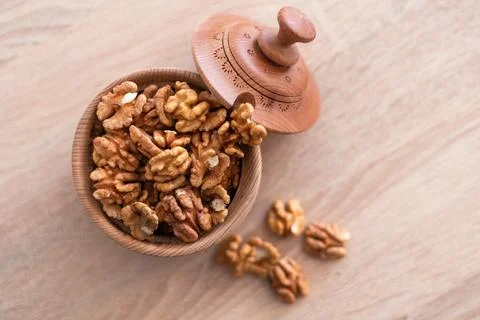 Whole walnuts and split on table. kernels of walnuts are dried and ready to eat Stock Photos