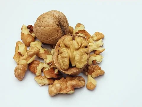Whole Walnuts and Walnut Kernels Isolated on White Background Stock Photos