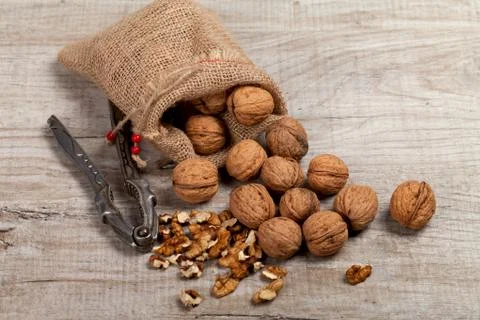 Whole walnuts, kernels on the table 写真素材