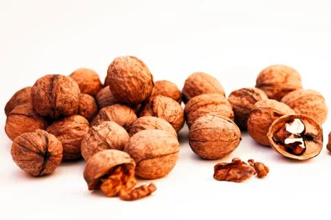 Whole walnuts kernels on white background. Stock Photos
