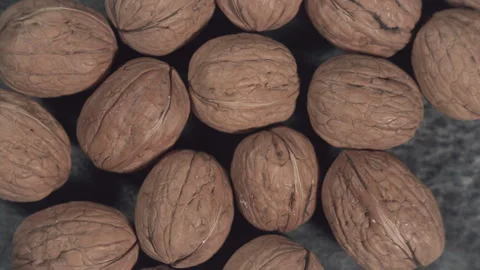 Whole walnuts in shells on dark background. Stock Footage 260244815