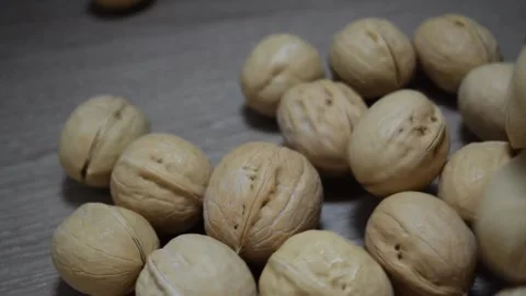 Whole walnuts on the table Stock Footage 334934419