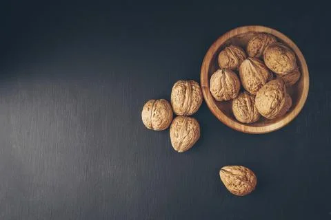 Whole walnuts. Walnuts. Nuts. Closeup.Nuts in a wooden bowl. Useful product.. Stock Photos