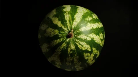 Whole Watermelon Is Rotating On A Black Background Video stock 113990712