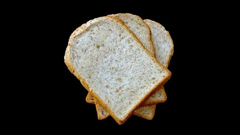 Whole wheat bread on black background. Stock Photos