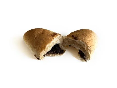 Whole wheat bread bun broken in half with chocolate filling Stock Photos