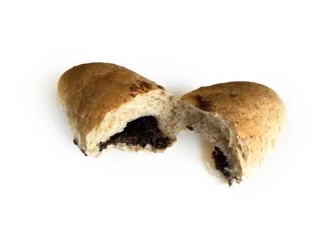 Whole wheat bread bun broken in half with chocolate filling Stock Photos